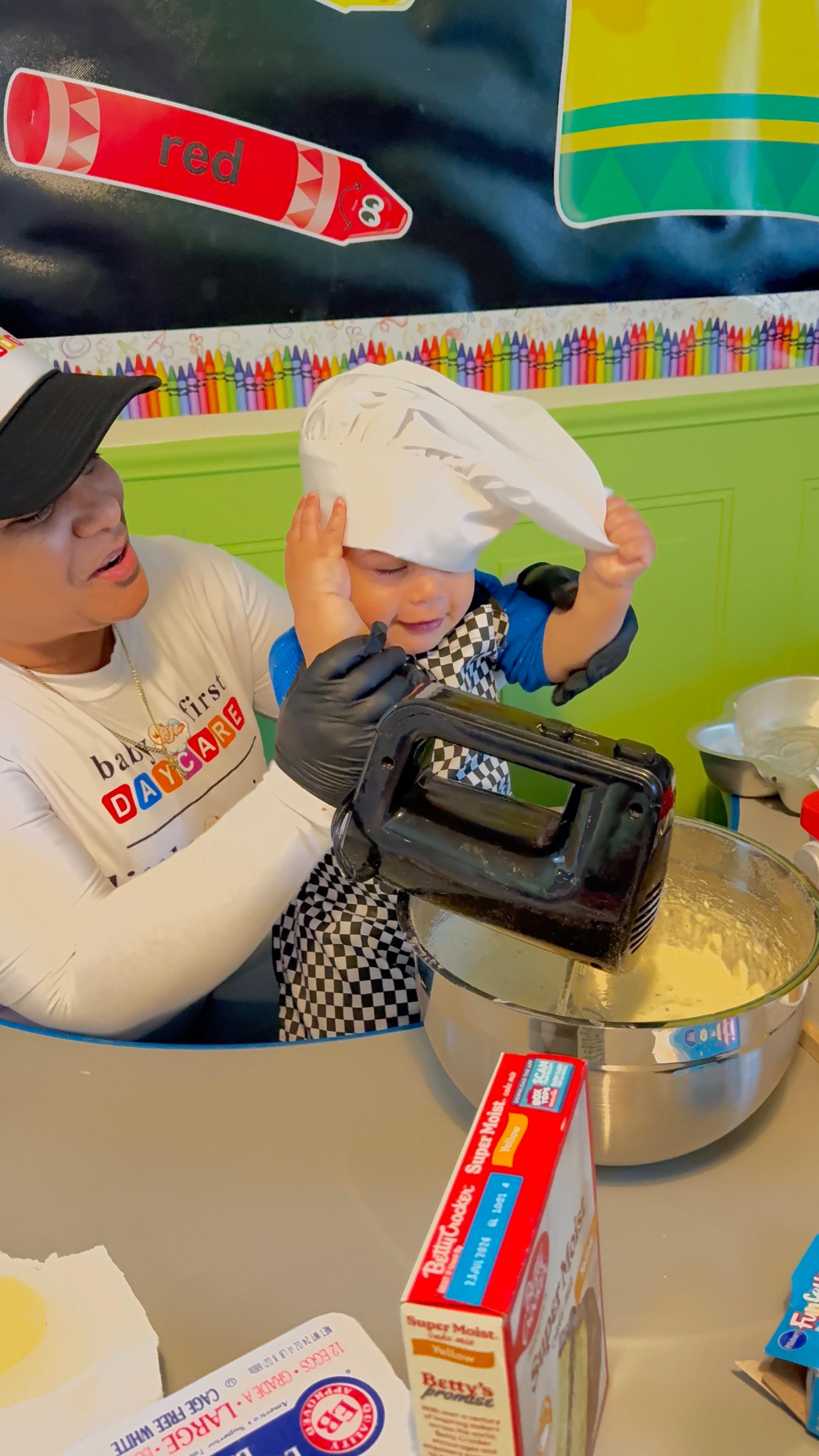 Child learning to bake with chef hat and mixing bowl